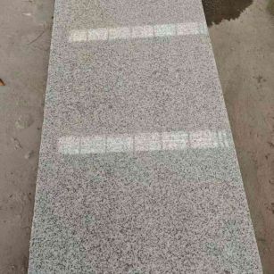 昌都芝麻白光面毛板